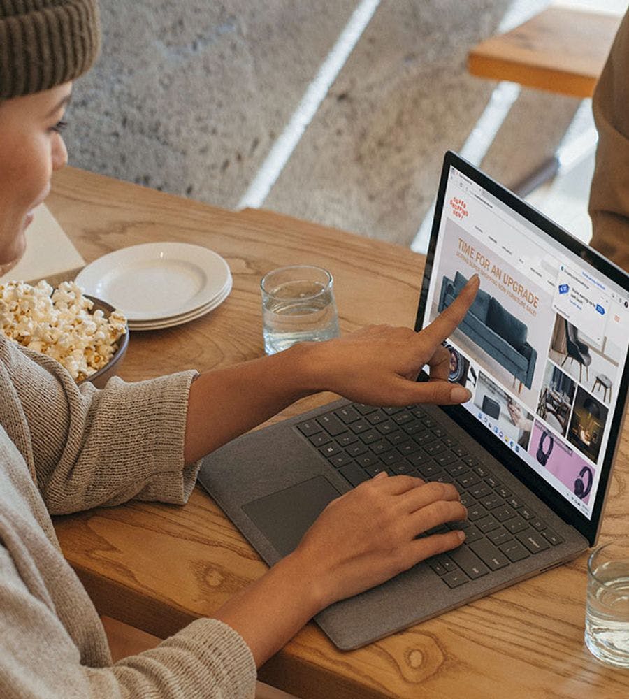 A person using a Microsoft Surface laptop